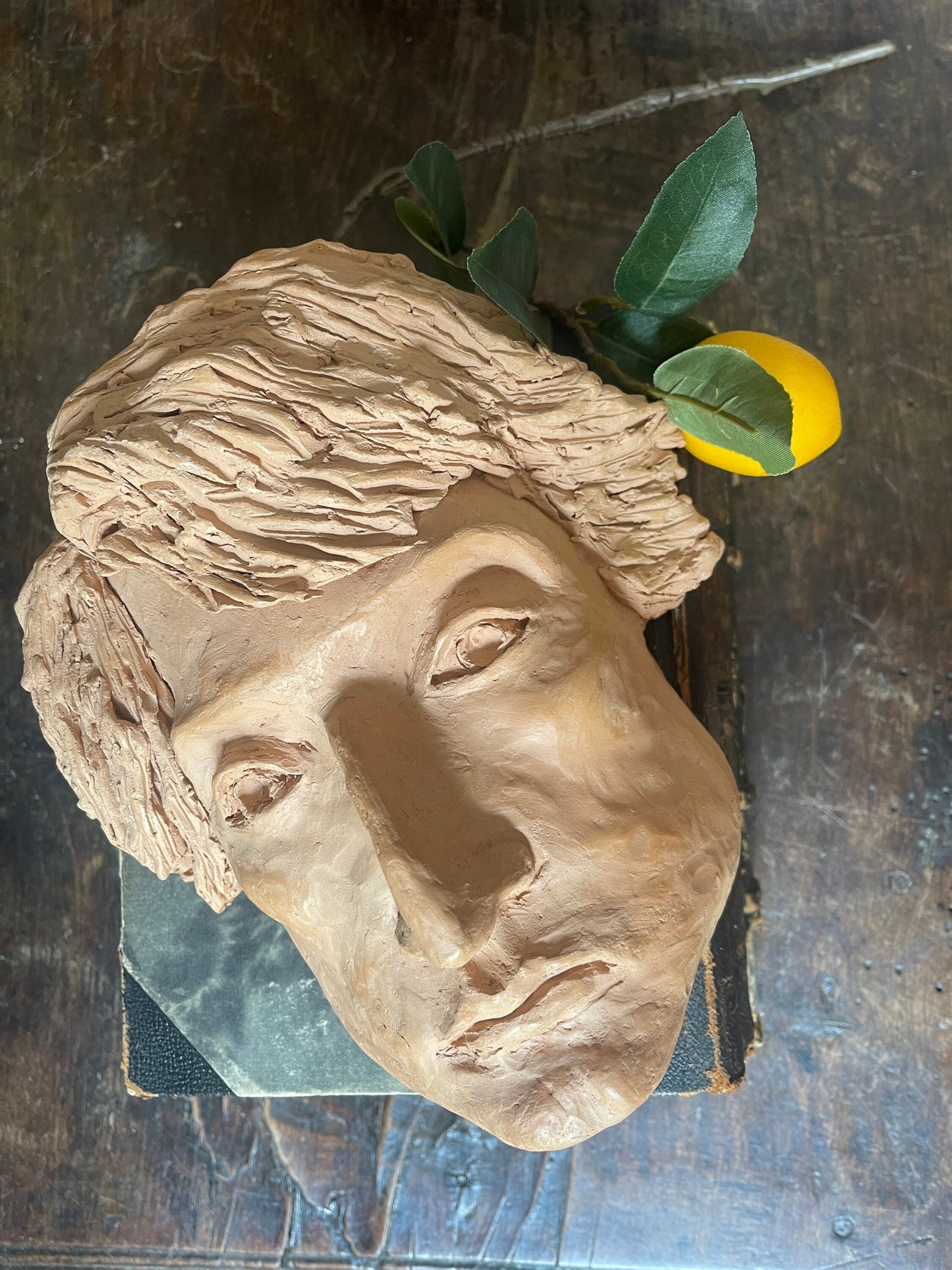 Clay sculpture of face postmodern decor