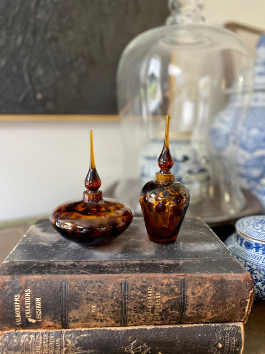 Pair of hand blown tortoise glass perfume bottles