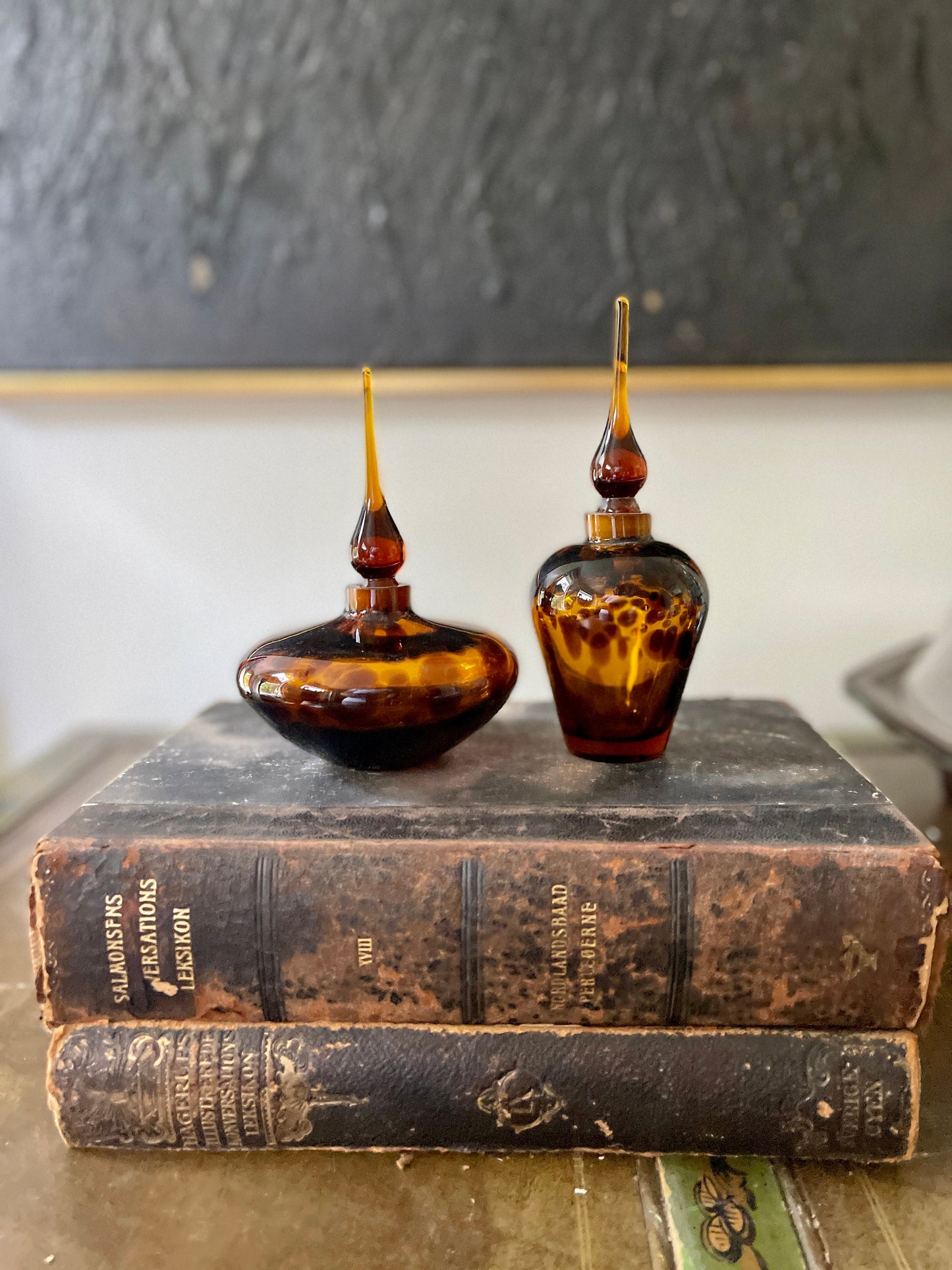 Pair of hand blown tortoise glass perfume bottles